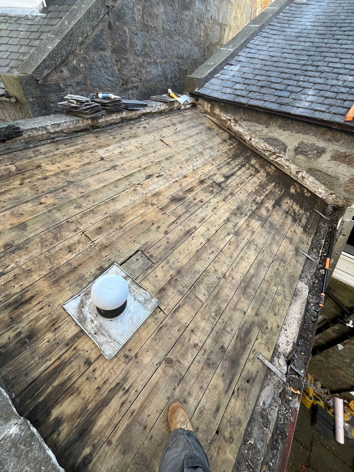 Old covering removed to expose timber sarking for renewal